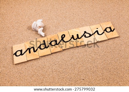 Words formed from small pieces of wood containing a sun and beach tourist destination, andalusia