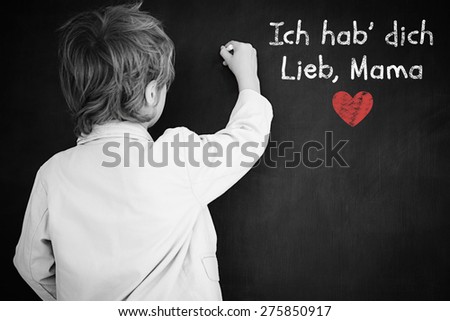 Schoolchild with blackboard against german mothers day message