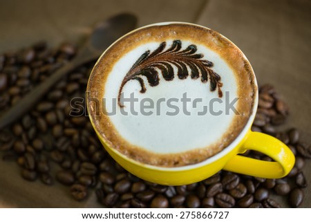 Mocha coffee with hot milk in coffee, beautiful makeup.