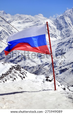Russian flag on the slope of mountain Elbrus on Caucasus