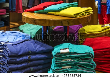 Colorful trousers, folded placed on Showcase.