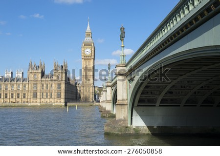 Scenic morning view of Big Ben and Houses of Parliament from Westminster Bridge beside the River Thames in London England 