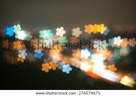 Blur image of Kuala Lumpur with flower shape bokeh
