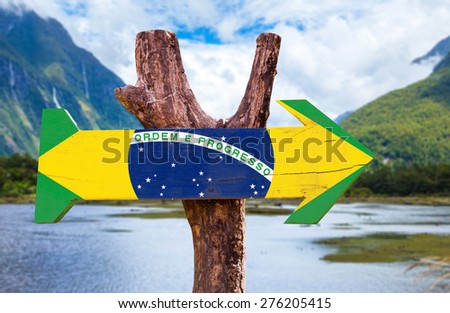 Brazil Flag wooden sign with mountains background Royalty-Free Stock Photo #276205415