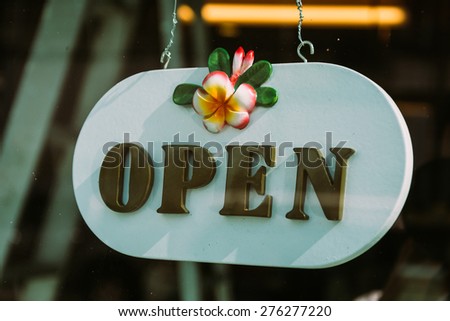 open sign on glass door