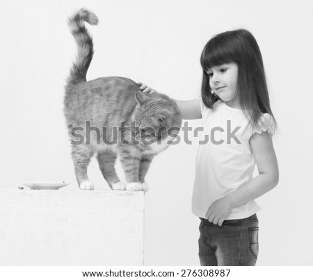Cute little girl portrait hug red cat smiling black and white
