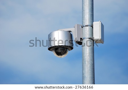 Security camera placed in a metallic row. Security concept