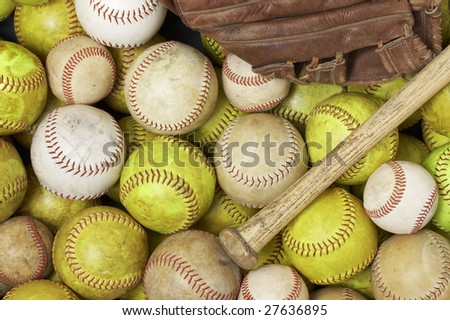 a picture of baseballs, softballs, a bat and glove