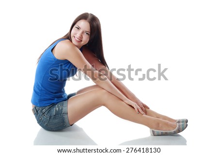 Teenage Girl sitting. White Background. Teenager