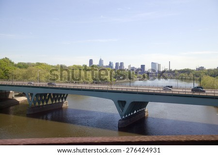 View of Schuylkill River and Philadelphia skyline from moving Amtrak train, Philadelphia, Pennsylvania
