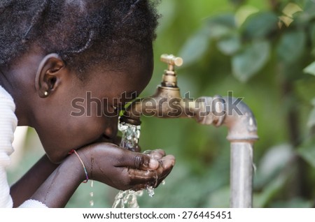 Clean Fresh Water Scarcity Symbol: Black Girl Drinking from Tap.

Young African girl drinking clean water from a tap. Hands with water pouring from a tap in the streets of the city Bamako, Mali. Royalty-Free Stock Photo #276445451