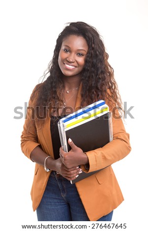 Beautiful african student woman posing isolated over white background Royalty-Free Stock Photo #276467645
