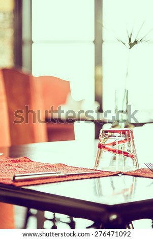 Selective focus point on glass in restaurant - vintage effect style pictures
