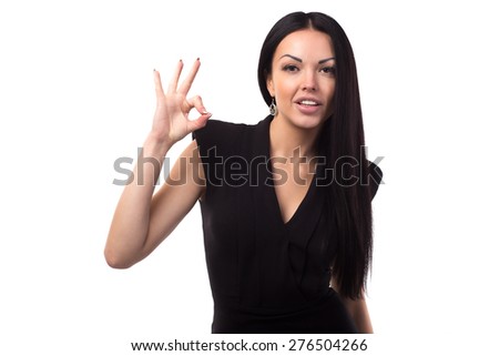 Portrait of happy smiling young woman showing okay gesture, isolated over white background