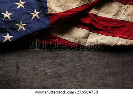 Old and worn American flag for Memorial Day or 4th of July