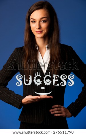 Beautiful young woman holding success caption motivational photo