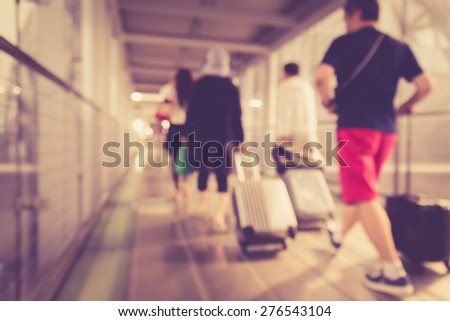 Blurred background : People walking in the airport with retro filter effect