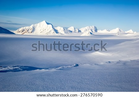 Arctic winter in south Spitsbergen Royalty-Free Stock Photo #276570590