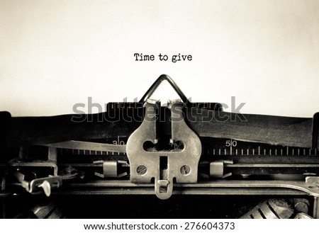 Time to Give message typed on a vintage typewriter. Time for Action
