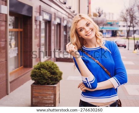 Pretty girl walking on a city street