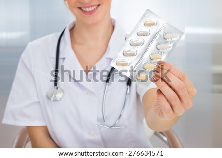 Close-up Photo Of Female Doctor Holding Medicine
