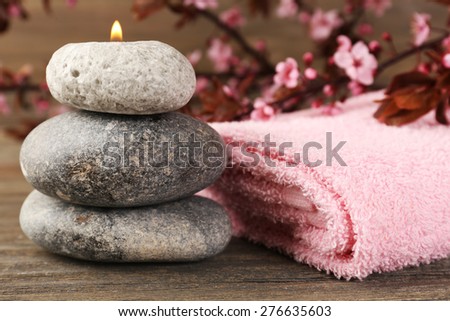 Spa still life with flowering branches on wooden table, closeup