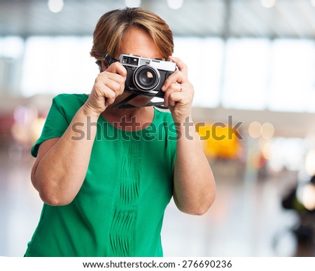 portrait of a mature woman ready to take a photo