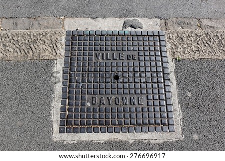 Bayonne city sidewalk metal plate