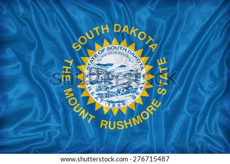 South Dakota flag on fabric texture,retro vintage style