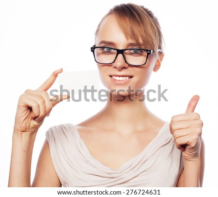 Happy beautiful businesswoman wearing  glasses  holding a blank card