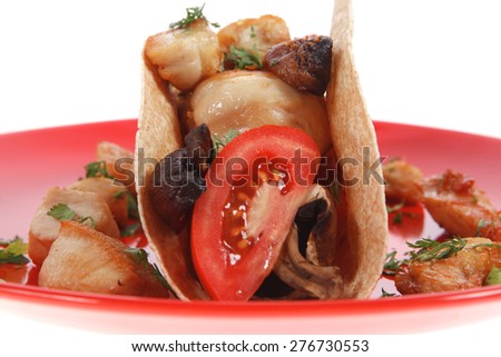 big mexican taco with tomatoes and mushroom on red plate isolated over white background