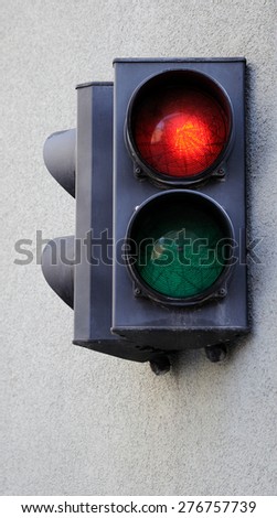 Traffic light fixed on the wall