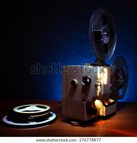 Vintage Film Projector in the Dusk on the Table