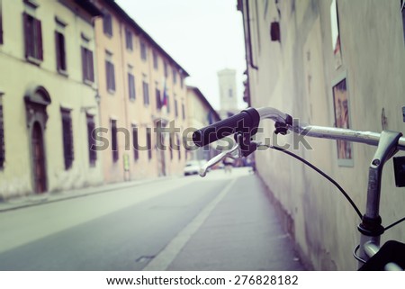 bicycle handlebar in a Bologna street in vintage tone