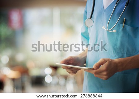 Healthcare And Medicine. Doctor using a digital tablet Royalty-Free Stock Photo #276888644