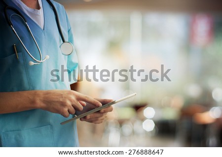 Healthcare And Medicine. Doctor using a digital tablet Royalty-Free Stock Photo #276888647
