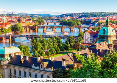 Scenic summer sunset aerial view of the Old Town pier architecture and Charles Bridge over Vltava river in Prague, Czech Republic Royalty-Free Stock Photo #276911168