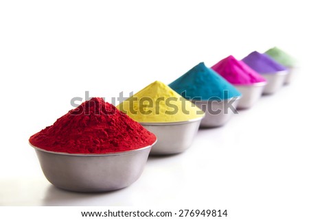 Row of colorful Holi powder in bows over white background