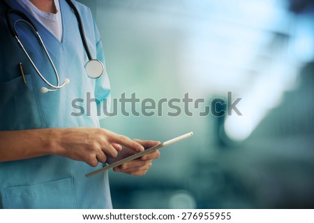 Healthcare And Medicine. Doctor using a digital tablet Royalty-Free Stock Photo #276955955