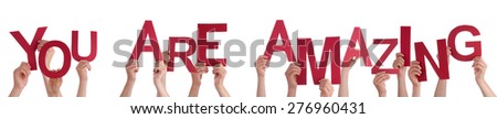 Many Caucasian People And Hands Holding Red Letters Or Characters Building The Isolated English Word You Are Amazing On White Background