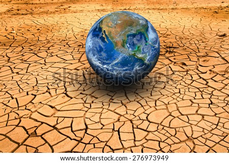 The earth on dry ground. Land with dry and cracked ground. Desert without water, climate change and global warming background, agriculture and food, Elements of this image furnished by NASA