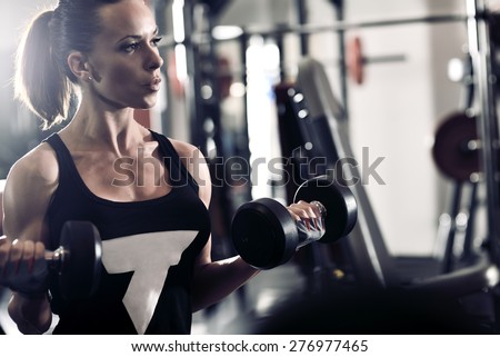 picture of young woman making exercise at the gym