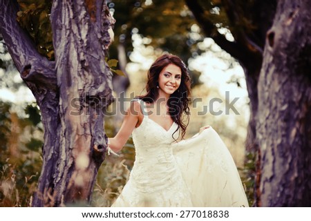 Wedding picture of happy  bride outside. 