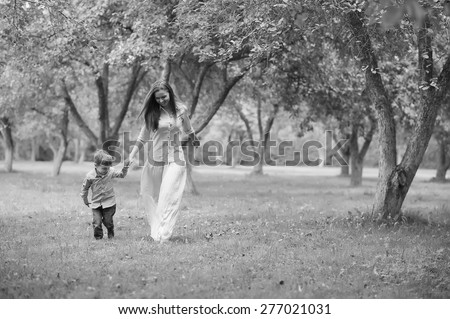 Beautiful mother and her child in the park