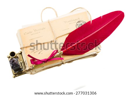 pile of old mail with inkwell  and feather pen isolated on white background