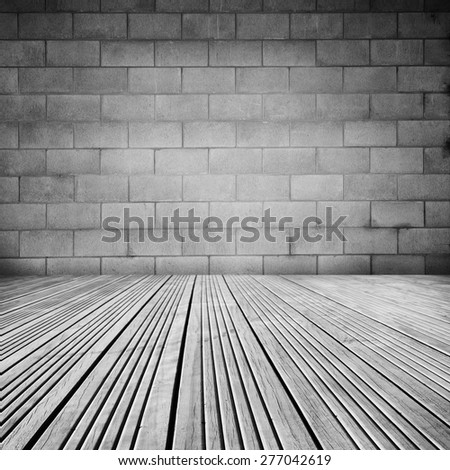 Wooden floorboards and block wall 