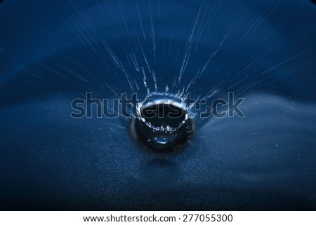water splash like crown on blue background 