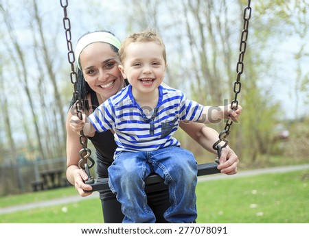 Happy Family Mother And Children On A Swing Happy Parent Swinging With Child Stock Photos And Images Avopix Com