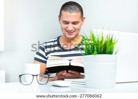 happy man enjoy reading his favorite book