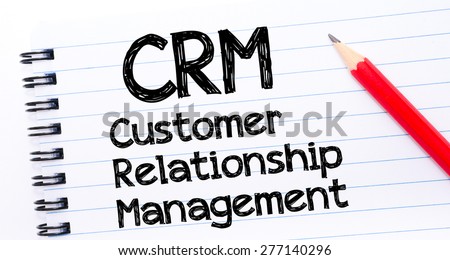 CRM acronym as Customer Relationship Management Text written on notebook page, red pencil on the right. Concept image